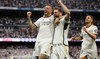 Real Madrid put one hand on title with Cadiz win