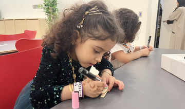 Children were encouraged to visit the nearby crafts table to decorate their own clothespin to take home as a souvenir. (AN photo