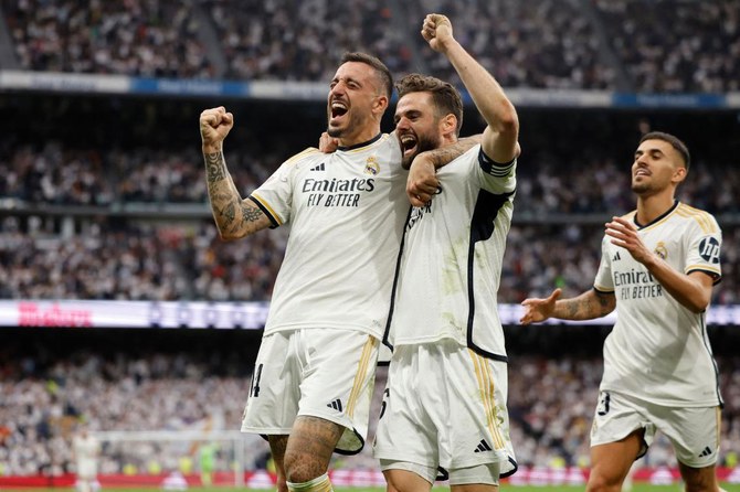 Real Madrid put one hand on title with Cadiz win